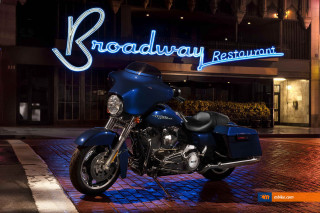 Blue motorcycle parked restaurant sign - a neon free wallpaper