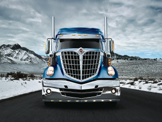 Blue semi truck driving road - the sky above free wallpaper