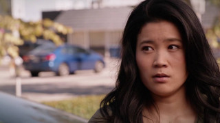 Woman car serious look camera - a car free wallpaper