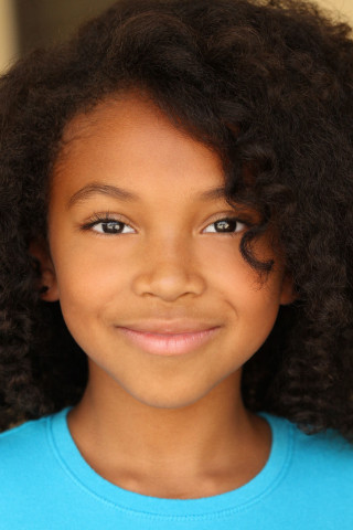 Young girl blue shirt brown - free portrait wallpaper