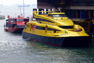 Yellow black boat docked water - adrian zingg free wallpaper
