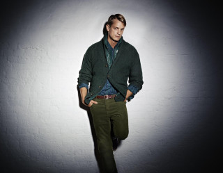 Man green sweater dark room - green pants free wallpaper