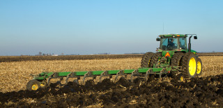 Tractor plowing field plow background - heavy grain free wallpaper
