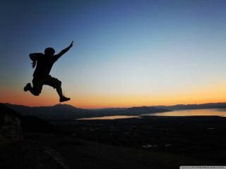 Man jumping skateboard sunset lake - energetic free wallpaper