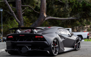 Black sports car parked road 4 - a white truck free wallpaper