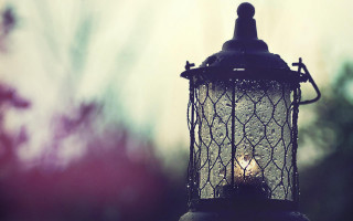 Lantern lit dark outside house - ambient light free wallpaper