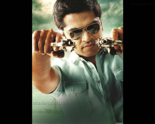 Man holding two guns wearing - sunglass free wallpaper