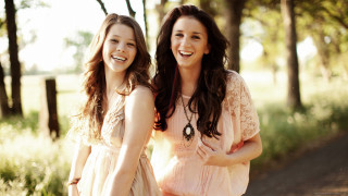 Women smiling forest trees grass - cheerful free wallpaper