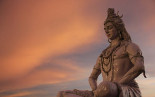 Statue man sitting rock sky - sky free wallpaper