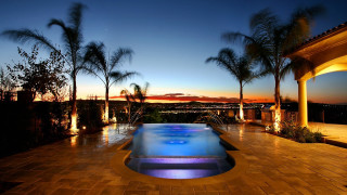 Pool city night palm trees - a view of a city free wallpaper