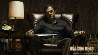 Man sitting chair book lap - bryan organ free wallpaper