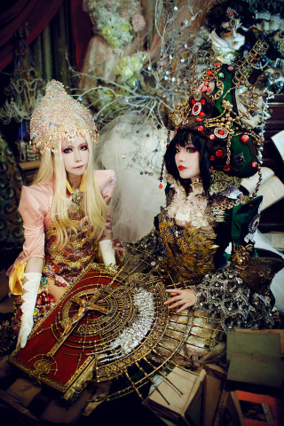 Women elaborate clothing table christmas - two woman free wallpaper for mobile