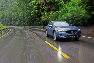 Blue car driving road forest 4 - a rainy day free wallpaper for desktop