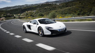 White sports car hill road 2 - a white sports car free wallpaper
