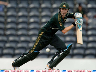 Man green uniform swinging bat - a bat free wallpaper