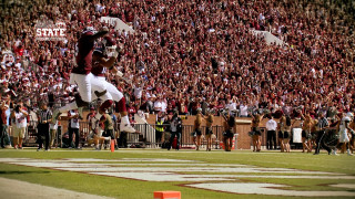 Football player jumping catching ball - epic composition free wallpaper