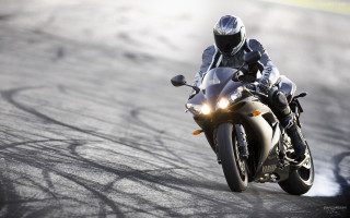 Person riding motorcycle track helmet 4 - a light free wallpaper