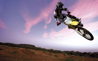 Man motorcycle air trick yellow 3 - a trick in the air free wallpaper