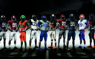 Football players standing helmets hands - helmet free wallpaper