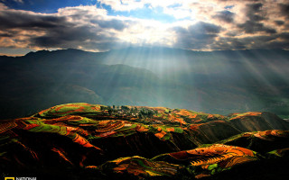 Mountain range sunshine clouds sunbeams - a view of a mountain range free wallpaper for desktop