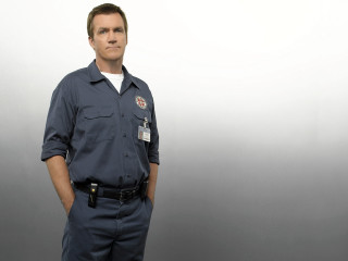 Man blue uniform standing wall - a blue uniform free wallpaper