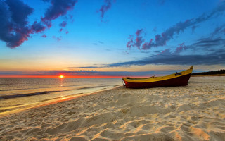 Boat beach sunset clouds ocean - a sandy beach next free wallpaper
