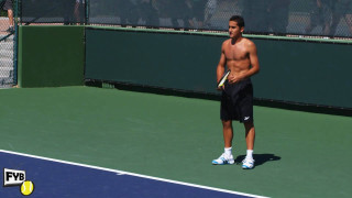 Man standing tennis court holding - his other hand free wallpaper