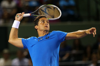 Man holding tennis racquet court 4 - david lazar free wallpaper