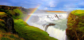 Rainbow waterfall ocean sky above - free seasons wallpaper for desktop