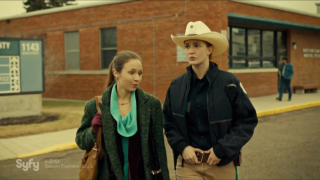 Man woman walking street building - free vintage wallpaper