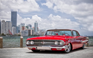 Red car city skyline lake - a large body of water in front free wallpaper