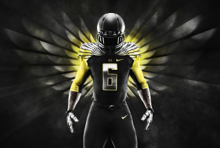 Football player yellow light black - a football player in a uniform free wallpaper