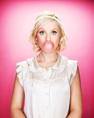 Woman blowing bubble pink background - free vintage wallpaper for mobile