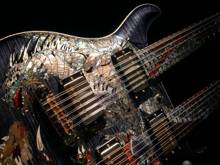 Guitar mosaic bridge cityscape pagoda - a close up of a guitar free wallpaper
