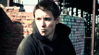 Man black hoodie brick wall - a black hoodie free wallpaper