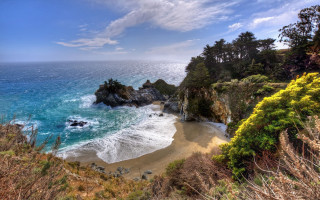 Beach water trees cliff rocks - a body of water and trees free wallpaper
