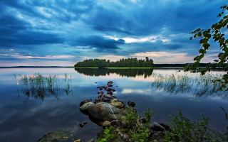 Rock formation lake sunset cloudy - a rock formation free wallpaper