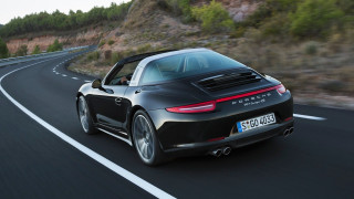 Black porsche sports car mountain 2 - a mountain in the background and trees free wallpaper for desktop