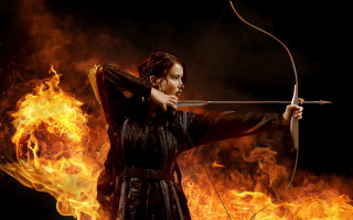 Woman holding bow arrow fire 2 - a bow and arrow in front free wallpaper