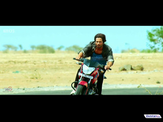 Man motorcycle road grass trees - movie still frame free wallpaper