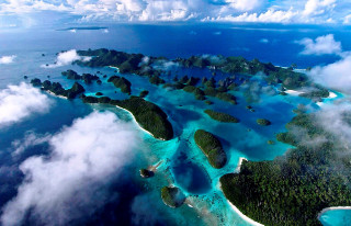 Aerial tropical island ocean clouds - an aerial view free wallpaper