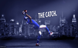 Football player catching ball the - a ball in the air free wallpaper