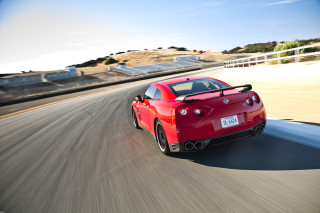 Red sports car road hill 2 - a fence free wallpaper for desktop
