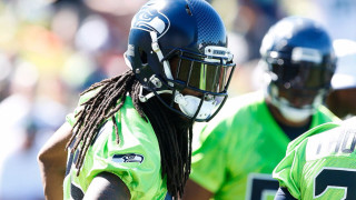 Football player dreadlocks helmet closeup - clear eye free wallpaper
