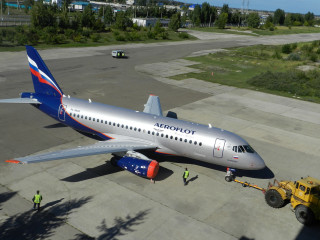 Jetliner yellowtruck fedotsychkov sideprofile forest - top of an airport tarmac next free wallpaper