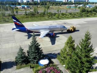 Jetliner tarmac truck trees aerial - aerial free wallpaper