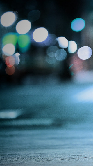 Blurry street stop sign car - a tilt shift photo free wallpaper for mobile