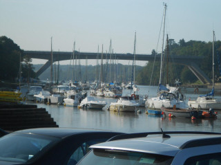 Boats parked water bridge over - a bunch of boats free wallpaper