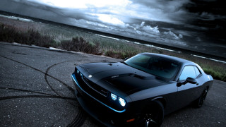 Black sports car ocean cloudy - cloud and grass free wallpaper