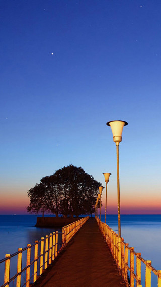 Long pier lamp post tree - ambient light free wallpaper for mobile